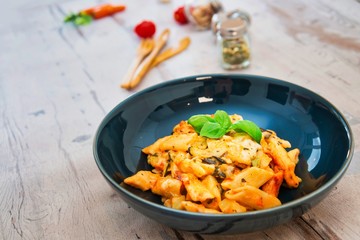 Penne gratin with vegetables, grilled zucchini and marinated tomatoes