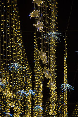 Naklejka na ściany i meble Christmas and New Year holidays illumination outdoor in city street at night