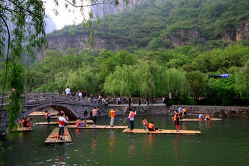 tourists driving the bamboo raft, yuntai mountain scenic spot, jiaozuo, henan province, China.