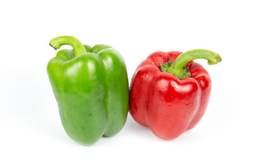 Two bell peppers on white background