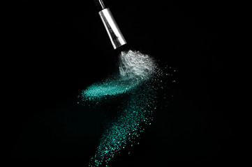Deep ocean powder color splash and silver brush for makeup artist or beauty blogger in black...