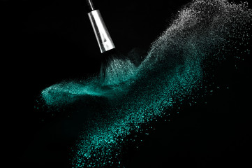 Deep ocean powder color splash and silver brush for makeup artist or beauty blogger in black...