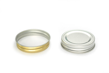 Jars lid golden color and silver color on white background.