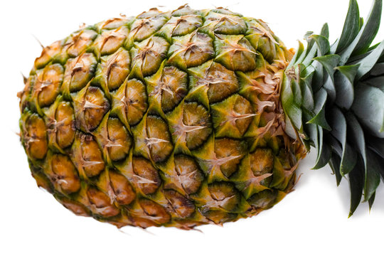 one ripe whole big pineapple horizontally