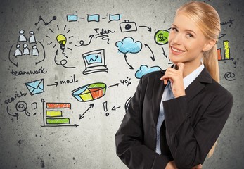 Smiling pretty woman holding finger on face