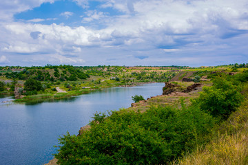 Fototapeta na wymiar a picturesque lake on the site of an abandoned quarry in Donbass