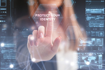 The concept of business, technology, the Internet and the network. A young entrepreneur working on a virtual screen of the future and sees the inscription: Protect your identity