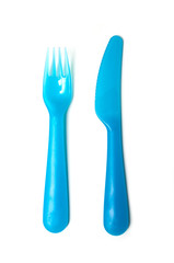set of blue baby plastic fork and knife on white background