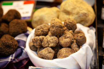 Truffles in a basket. Sell a rare species of mushrooms at the fair