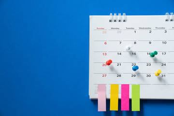 close up of calendar on the blue table, planning for business meeting or travel planning concept © tatomm