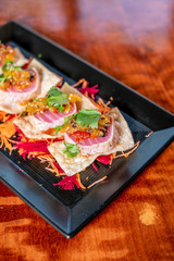 Seared Ahi Tuna Sashimi Appetizer on Wonton Crisp