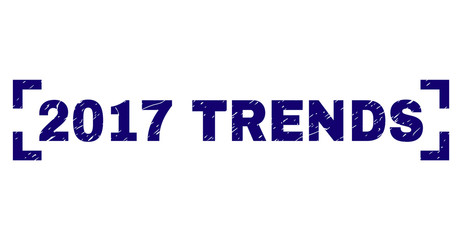 2017 TRENDS text seal print with distress effect. Text title is placed between corners. Blue vector rubber print of 2017 TRENDS with dirty texture.