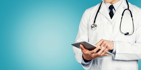 Close-up Doctor at hospital working with tablet