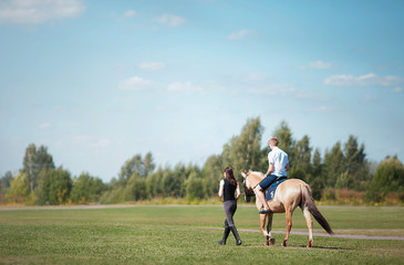 young woman riding horse