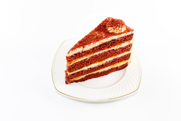 Red valvel cream cheese cake on white isolated background with copy space.
