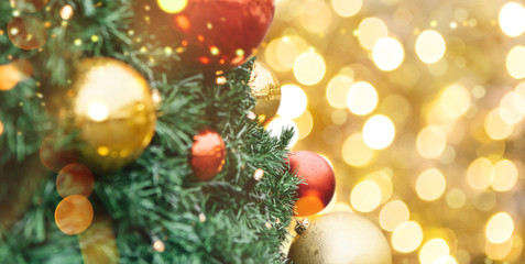 Close-up of Christmas decorations. Red and gold balls on a Christmas tree.