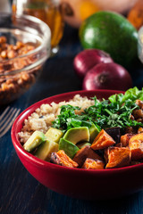 Colorful buddha bowl with quinoa and roasted and fresh vegetables