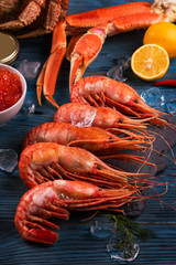 Set of seafood: red and black caviar, limb of hairy crab, limb of snow crab, far eastern kamchatka crab