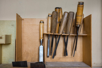 Tools for making violins and other musical instruments in luthier workshop.