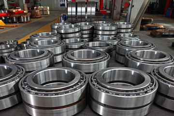 Manufacture of bearings in the factory.The chrome surface of products. Industrial theme. Production of bearings.