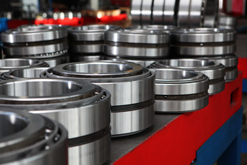 Manufacture of bearings in the factory.The chrome surface of products. Industrial theme. Production...
