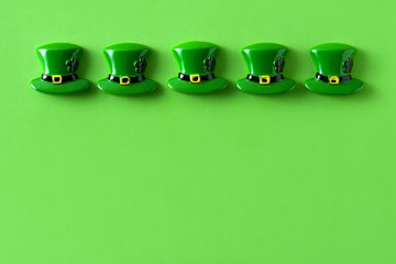St. Patrick Day symbols on green background. Copyspace

