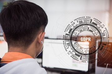GDPR Concept, Smart man use computer monitor for check data protection regulation with HUD screen presented symbol connected icons over technologies. Idea for cyber security and privacy protect.
