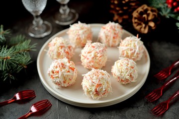 Cheese balls in crab shavings is a traditional Russian snack for Christmas and New Year's party. © chudo2307