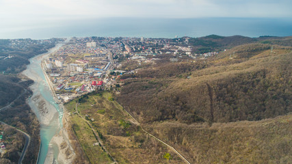 Fototapeta na wymiar Lasarevskoye, Sochi. Winter. Aerial view of a coastal town in mountains