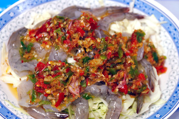 Shrimp in fish sauce Spicy hot, Shrimp in fish sauce Topped with chili peppers, Shrimp sea foods menu in chili sauce spicy close up (street food of thai)