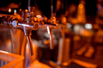 Beer taps in a pub. Close up of beer Tap. Selective focus.