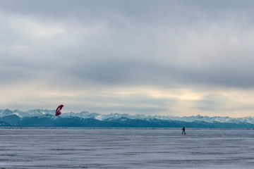 man kiting on the ice of lake Baikal