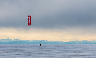 man kiting on lthe lake