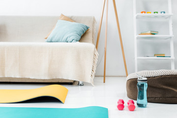 sport equipment on floor in living room