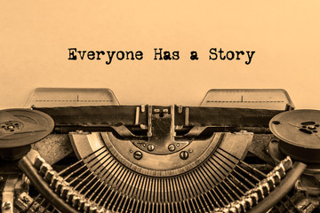 Everyone has a story on a sheet of paper printed on a vintage typewriter.