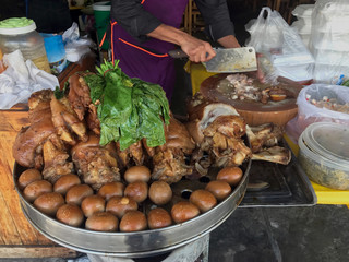Stewed pork leg at rice shop, Egg and Pork in Sweet Brown Sauce, Cooked Stewed pork leg warmed, Egg and Pork in Sweet Brown Sauce, Boiled eggs in sweet gravy with herb, Popular street foods Thailand