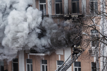 Odessa, Ukraine - Dec. 29, 2016: A fire in an apartment building. Strong bright light and clubs,...