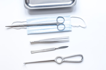 instruments for plastic surgery on white background top view