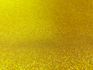 Obraz premium blurred gold image bokeh light shine for merry christmas celebrate glitter background, beautiful glitter golden glow bokeh sparkle bright luxury for backdrop, surface gold texture effect glowing shiny