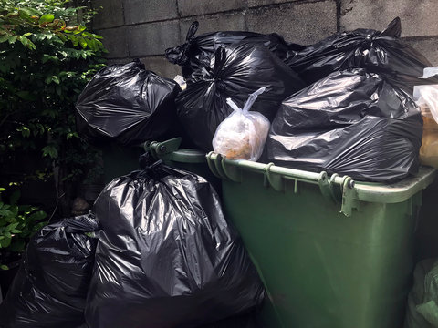 garbage is pile lots dump, many garbage plastic bags black waste at walkway community village, pollution from trash plastic waste garbage, bags bin of plastic waste, pile garbage waste, lots junk dump