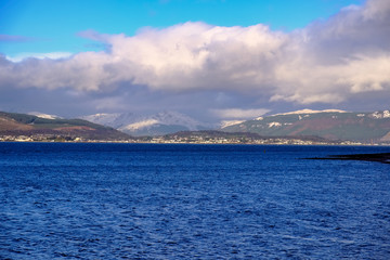 Fototapeta premium First Snows on the Argyle Hills in Scotland Looking over from Gourock.