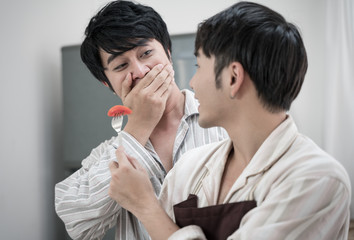 Sweet gay couple preparing food