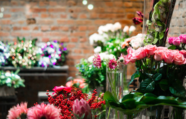 Fototapeta na wymiar stylish flower shop with brick walls