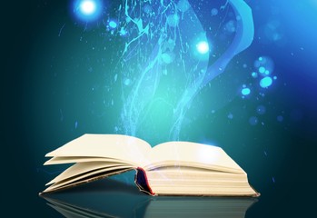 Open book on old wooden table at library background