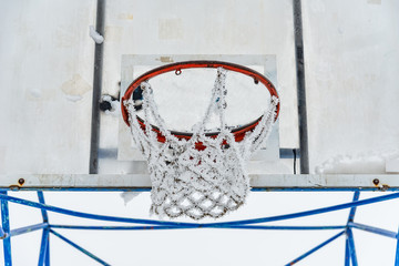 Fototapeta premium Basketball court covered with snow