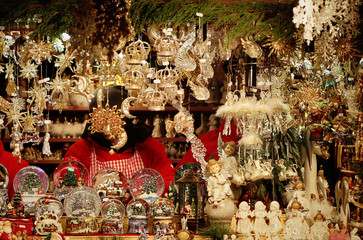 Christmas market in Munich, stall selling traditional Christmas decoration, angels and snowglobes