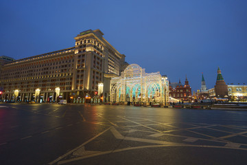 Fototapeta na wymiar Bright Moscow street at the night time. Manezhnaya square had been illuminated very brightly.