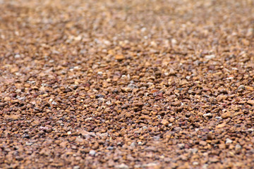 brown stone grit scree, stone floor grit scree for background, floor surface rock materials scree texture, brown gravel stone texture, granite gravel of macadam, rock crushed for ground construction