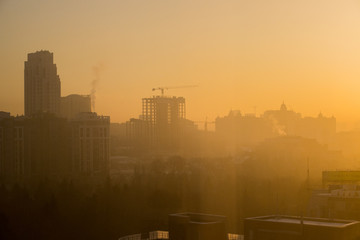 city in smog and fog, buildings silhouettes
