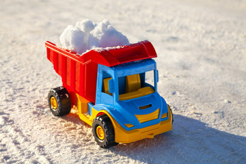 toy truck removes snow on highway